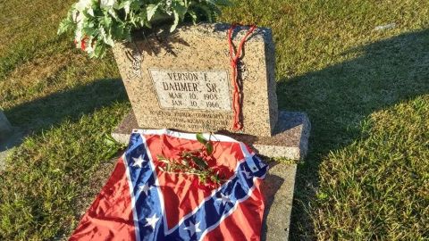 Bivins says she placed the flag on Vernon Dahmer's grave as a gesture of hope for the end of racism.