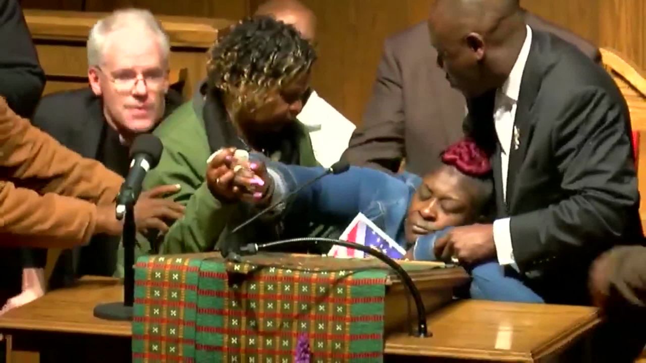 April Pipkins collapses into the arms of attorney Benjamin Crump on Tuesday night at the 16th Street Baptist Church in Brimingham, Alabama.