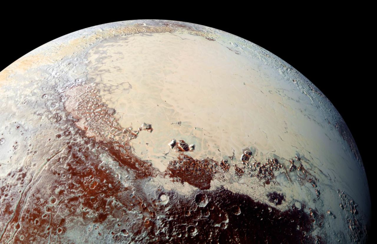 This high-resolution image captured by NASA's New Horizons spacecraft shows Pluto's surface has a remarkable range of subtle colors, enhanced in this view to a rainbow of pale blues, yellows, oranges, and deep reds. The bright expanse is the western lobe of the "heart," informally known as Tombaugh Regio. The lobe, informally called Sputnik Planum, has been found to be rich in nitrogen, carbon monoxide, and methane ices.