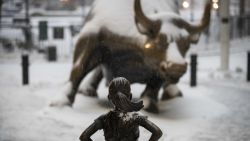 NEW YORK, NY - MARCH 14: The 'Fearless Girl' statue stands in the snow and wintry mix in the Financial District, March 14, 2017 in New York City. The blizzard warning for New York City has been cancelled and the National Weather Service is now predicting 4 to 8 inches for the city.