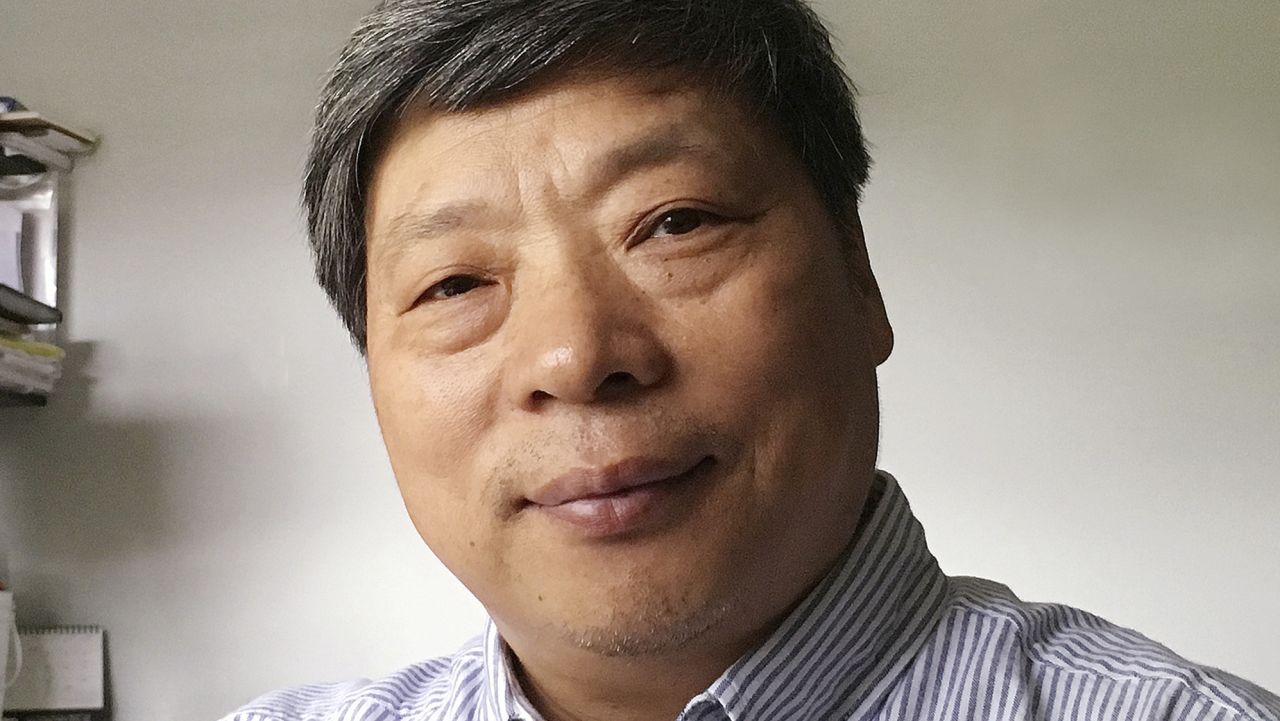 In this photo taken on July 2018 and released by Xu Xiaoli on Wednesday, Nov. 28, 2018, Lu Guang poses for a photo in New York. The wife of award-winning Chinese photographer Lu says he was taken away by state security agents more than three weeks ago during a trip to the country's far west. Lu's wife, Xu, says he was traveling in Xinjiang when she lost contact with him. (Xu Xiaoli via AP)