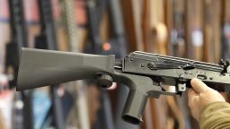 A bump stock device, (left) that fits on a semi-automatic rifle to increase the firing speed, making it similar to a fully automatic rifle, is installed on a AK-47 semi-automatic rifle, (right) at a gun store on October 5, 2017 in Salt Lake City, Utah. (George Frey/Getty Images)