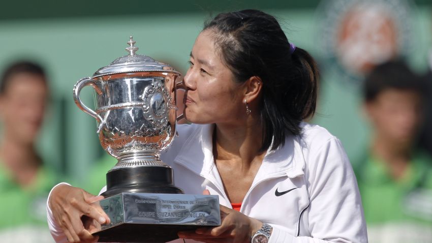 China's Li Na holds her trophy after winning against Italia's Francesca Schiavone their Women's final match in the French Open tennis championship at the Roland Garros stadium, on June 4, 2011 in Paris. (Photo credit should read THOMAS COEX/AFP/Getty Images)