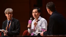Chinese scientist He Jiankui in a discussion with head of the Laboratory of Stem Cell Biology and Developmental Genetics at the Francis Crick Institute, Robin Lovell-Badge at the Second International Summit on Human Genome Editing in Hong Kong on November 28, 2018. 
