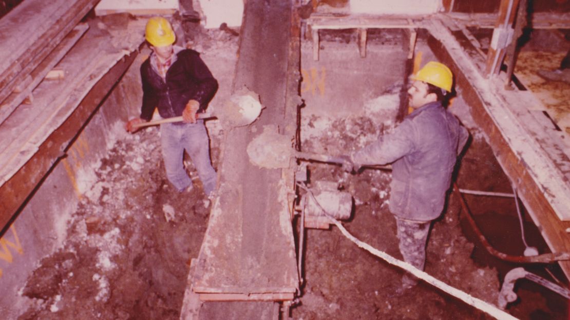 Authorities excavate the bodies of 27 victims found in the crawl space under Gacy's home in December 1978. 