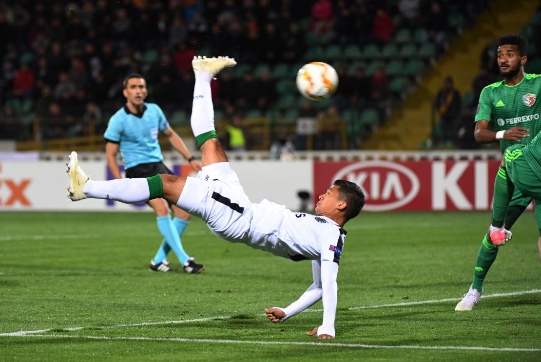 Sporting Lisbon's Colombian forward Freddy Montero acrobatically kicks the ball in the game against Vorskla.