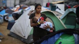 Jessica Perez, 18, from El Salvador, part of a caravan of thousands of migrants from Central America trying to reach the United States, nurses her 6-month-old son, Giovanni, in a temporary shelter in Tijuana, Mexico, November 28, 2018. REUTERS/Lucy Nicholson