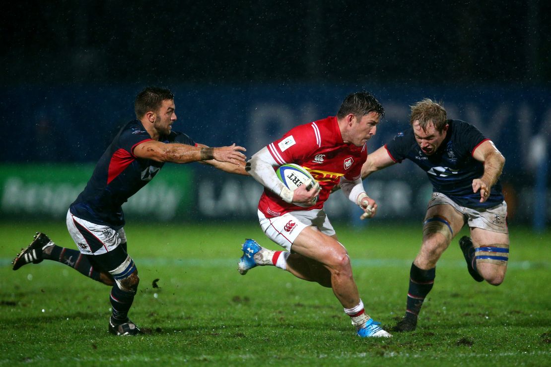 DTH van der Merwe makes a break for Canada against Hong Kong in Marseille.