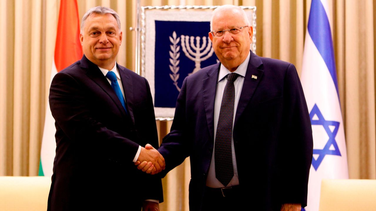 Israeli President Reuven Rivlin (R) shakes hand with Hungarian Prime Minister Viktor Orban prior to their meeting at the presidential compound in Jerusalem on July 19, 2018