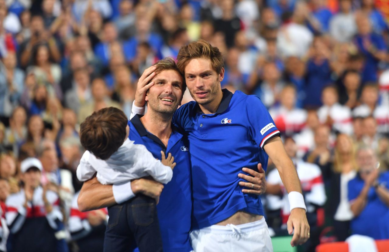 In his farewell Davis Cup outing in September, Benneteau (seen here with his son) and Nicolas Mahut won in doubles against Spain. 