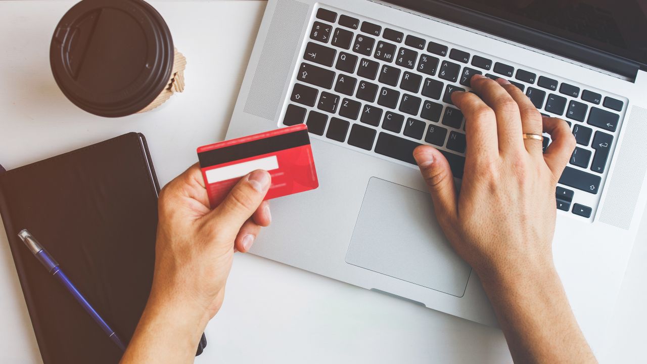 Top view of man using credit card for online shoping; Shutterstock ID 1020500191; Job: -