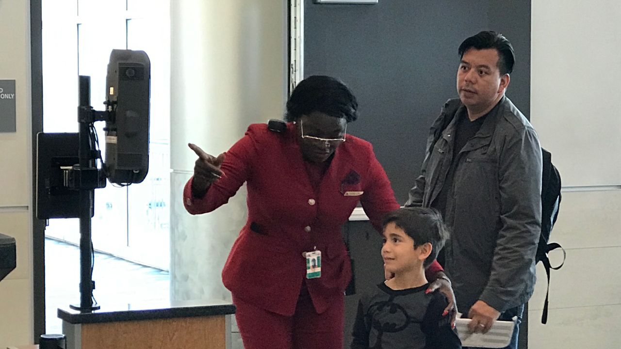Passengers use a facial recognition screen to verify their identities before boarding a Delta Air Lines flight from Atlanta to Mexico City on Thursday.  
