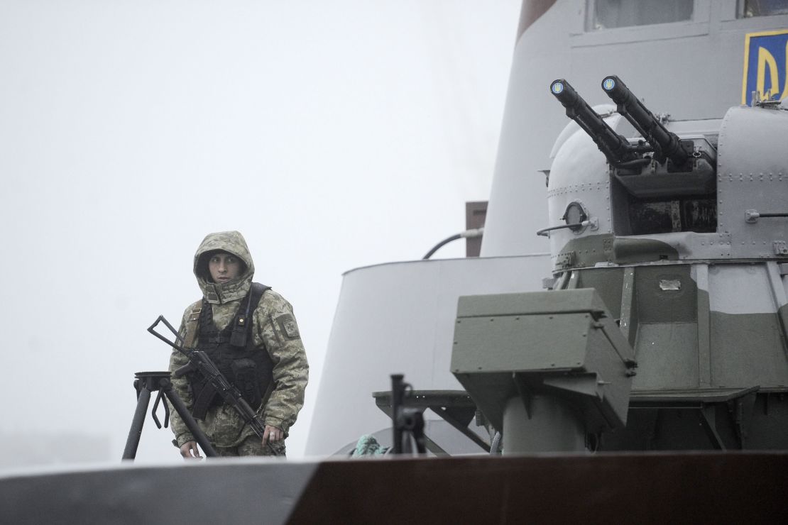 Ukrainian soldier patrols aboard military boat called "Dondass" moored in Mariupol, Sea of Azov port on November 27, 2018.