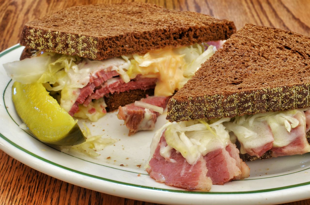 <strong>Add some toppings: </strong>Pile some corned beef and Swiss cheese on your rye and you have the start of a tasty Reuben.