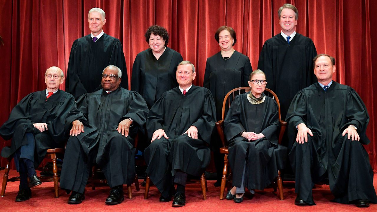 Justices of the US Supreme Court pose for their official photo at the Supreme Court in Washington, DC on November 30, 2018. - Standing from left: Associate Justice Neil Gorsuch, Associate Justice Sonia Sotomayor, Associate Justice Elena Kagan and Associate Justice Brett Kavanaugh.Seated from left to right, bottom row: Associate Justice Stephen Breyer, Associate Justice Clarence Thomas, Chief Justice John  Roberts, Associate Justice Ruth Bader Ginsburg and Associate Justice Samuel Alito. (Photo by MANDEL NGAN / AFP)        (Photo credit should read MANDEL NGAN/AFP/Getty Images)