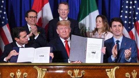 Mexico's President Enrique Pena Nieto (L) US President Donald Trump (C) and Canadian Prime Minister Justin Trudeau, sign a new free trade agreement in Buenos Aires, on November 30, 2018, on the sidelines of the G20 Leaders' Summit. - The revamped accord, called the US-Mexico-Canada Agreement (USMCA), looks a lot like the one it replaces. But enough has been tweaked for Trump to declare victory on behalf of the US workers he claims were cheated by NAFTA. (Photo by SAUL LOEB / AFP) (Photo credit should read SAUL LOEB/AFP/Getty Images)