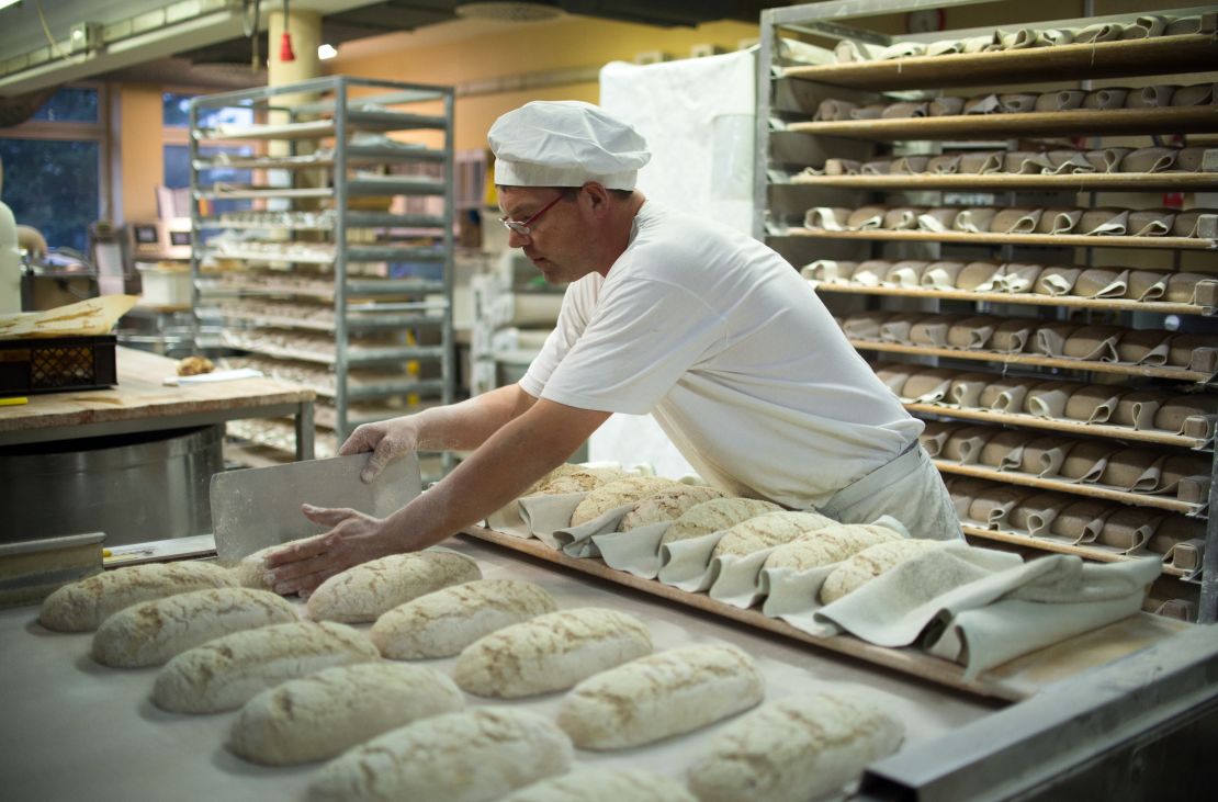 A master baker prepares bread at a bakery in Schwante.
