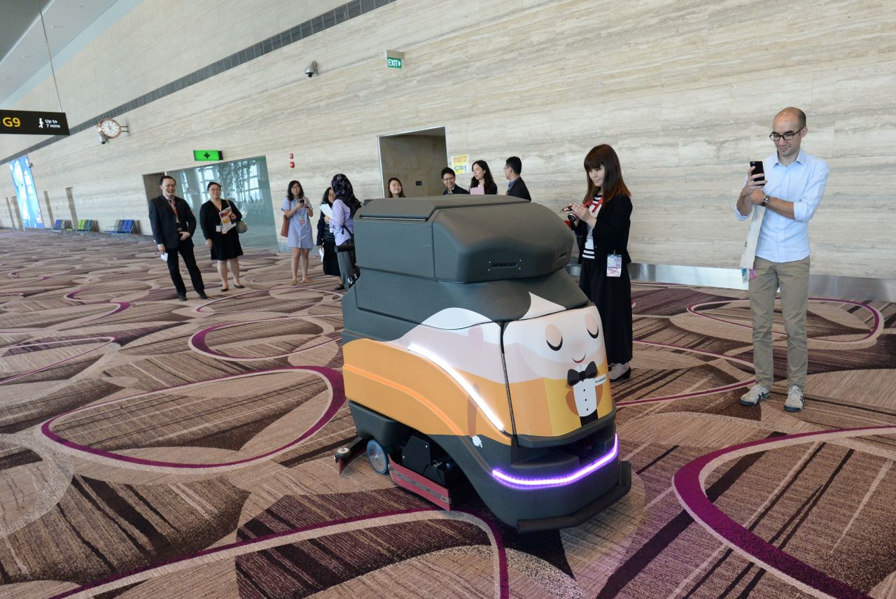 A robot vacuums the floor at Changi Airport in Singapore.