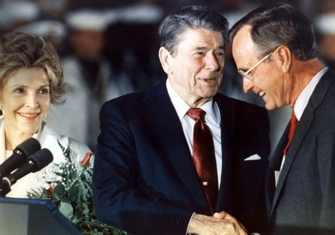 Reagan shakes hands with Bush in 1988. Bush served as Reagan's vice president from 1981 to 1989, and he would succeed him as President.