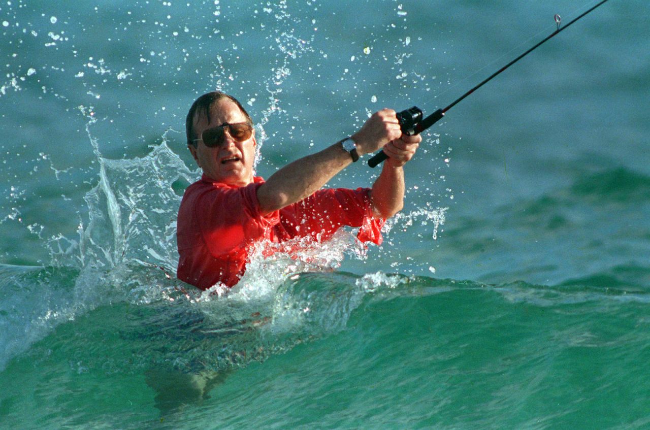 Shortly after winning the election, Bush casts a line while surf fishing in Gulf Stream, Florida. 