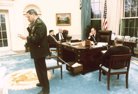 Bush and Colin Powell, the chairman of the Joint Chiefs of Staff, speak on separate phones in February 1991 while Joint Chiefs John Sununu, Robert Gates and Brent Scowcroft listen to a conversation about halting the Gulf War.