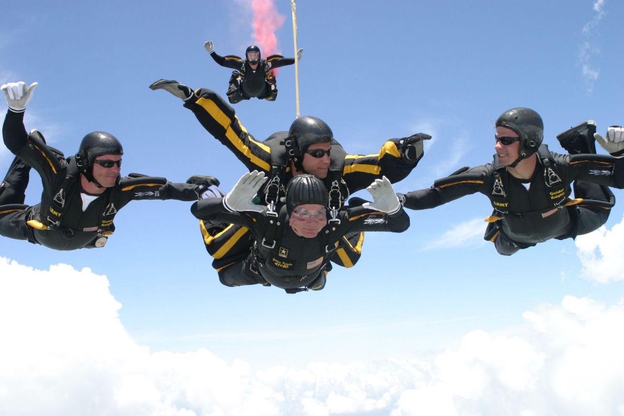 Celebrating his 80th birthday in 2004, Bush performs one of two skydiving jumps he completed with the Army Golden Knights.