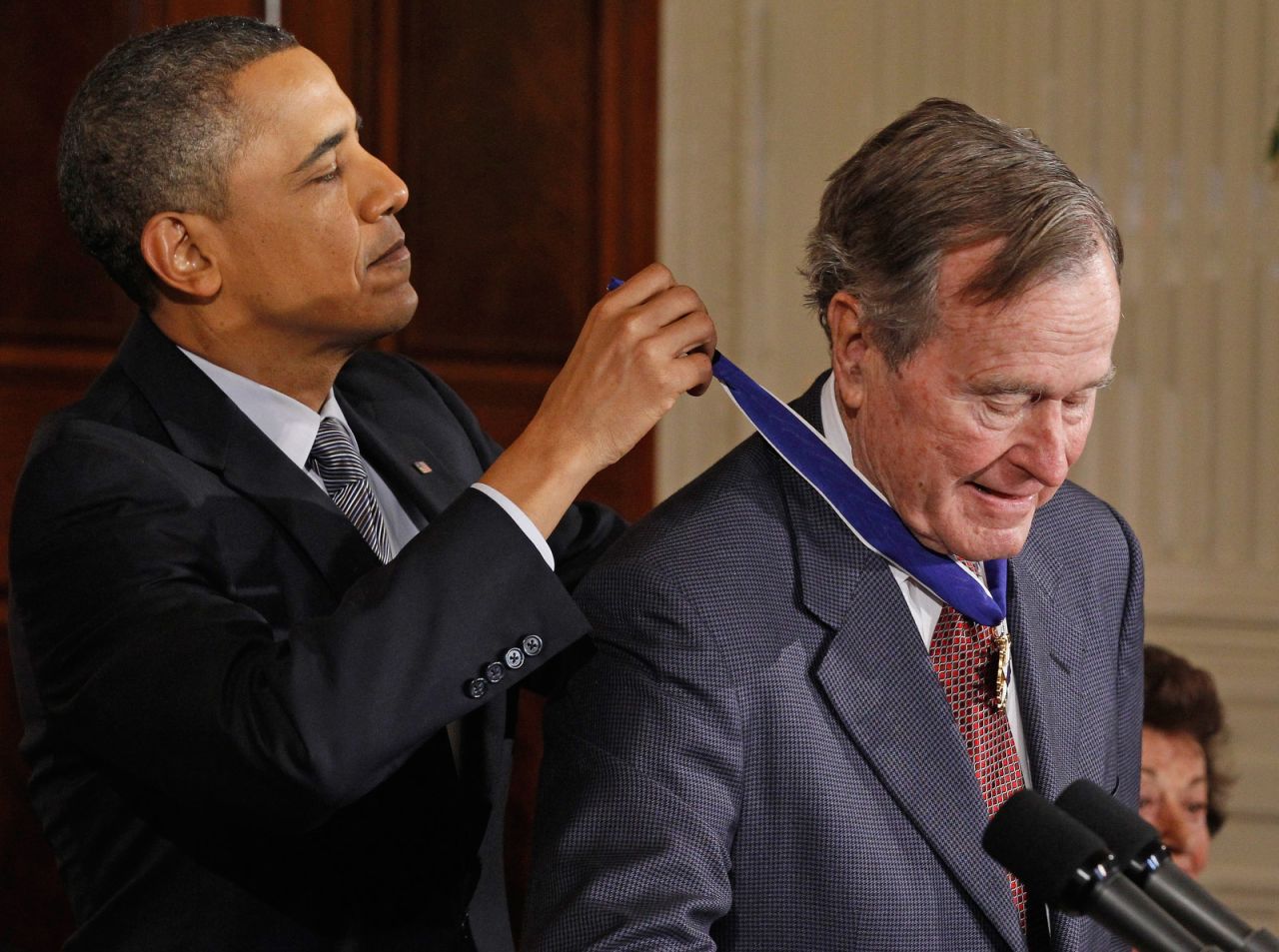 President Barack Obama presents Bush with the Medal of Freedom in February 2011. "His life is a testament that public service is a noble calling. ... His humility and his decency reflects the very best of the American spirit," Obama said.
