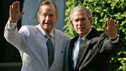 WASHINGTON - MAY 6:  U.S. President George W. Bush (R) and his father, former U.S. President George Bush (L) wave as the leave a family wedding at St. John's Episcopal Church May 6, 2006 in Washington, DC. Alexander Ellis, son of George W. Bush's cousin, married Sarah Aker.  (Photo by Normand Blouin/Pool/Getty Images)