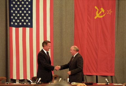 Bush and Gorbachev shake hands at the end of a news conference in Moscow in July 1991.