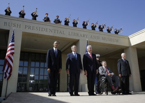 Bush, in the wheelchair, arrives for the dedication of his son's presidential library in Dallas in 2013. Joining him, from left, are President Barack Obama and former Presidents George W. Bush, Bill Clinton and Jimmy Carter.
