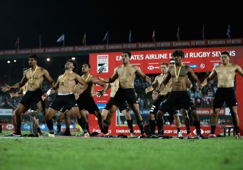 New Zealand players perform the haka after winning the Dubai Sevens title by defeating USA. 