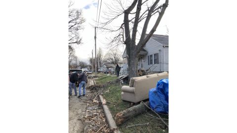 Taylorville neighbors go through the debris after the storm.