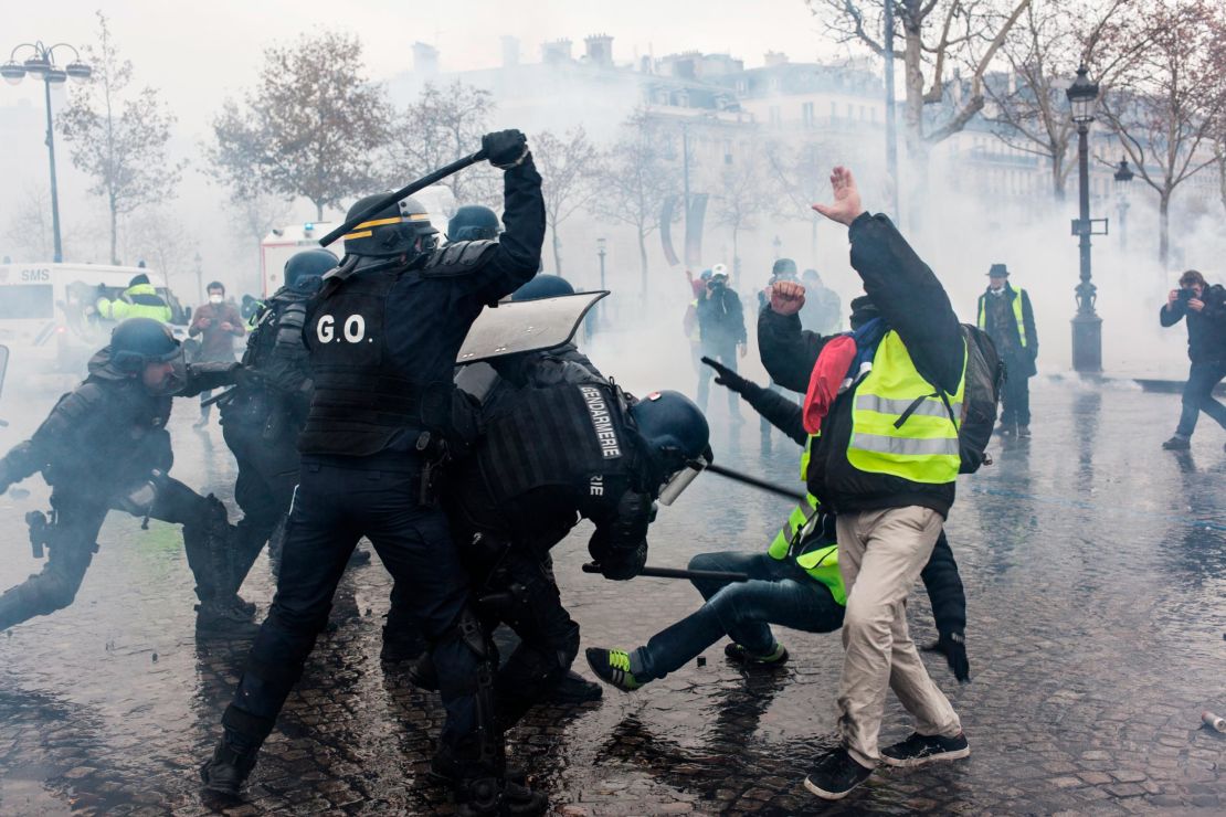 Protesters and riot police clash during the "yellow vest" protests in Paris on December 1. 