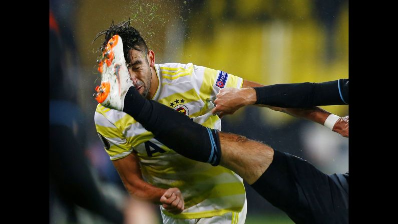 Mauricio Isla of Fenerbahce is kicked in the face during a match against GNK Dinamo Zagreb on Thursday, November 29, in Istanbul.