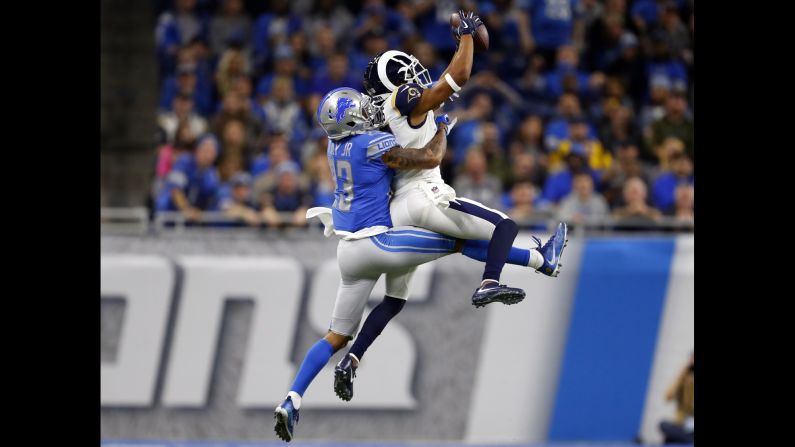 Los Angeles Rams wide receiver Robert Woods catches a pass while being defended by Detroit Lions cornerback Darius Slay in an NFL game on Sunday, December 2, in Detroit.