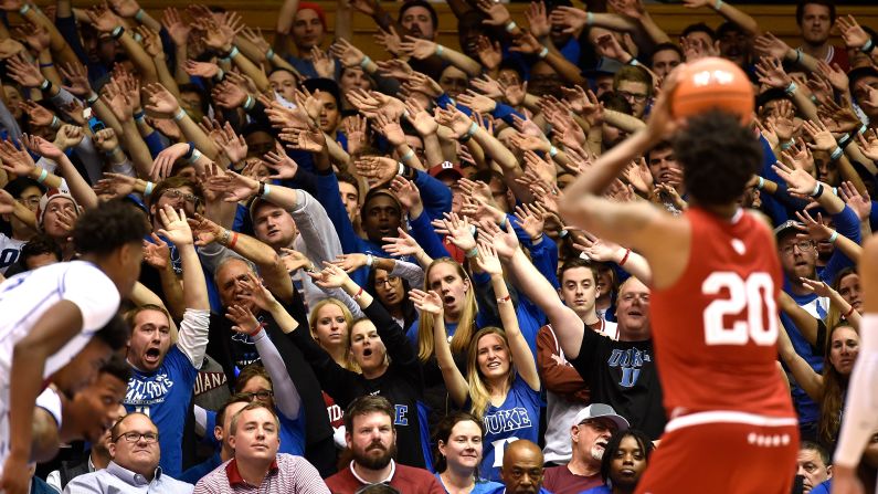 Duke basketball fans, also known as the "Cameron Crazies," attempt to distract Indiana Hoosiers player De'Ron Davis during a game at Cameron Indoor Stadium in Durham, North Carolina, on Tuesday, November 27. The No. 3 ranked Blue Devils won the game 90-69 to improve their record to 5-1.