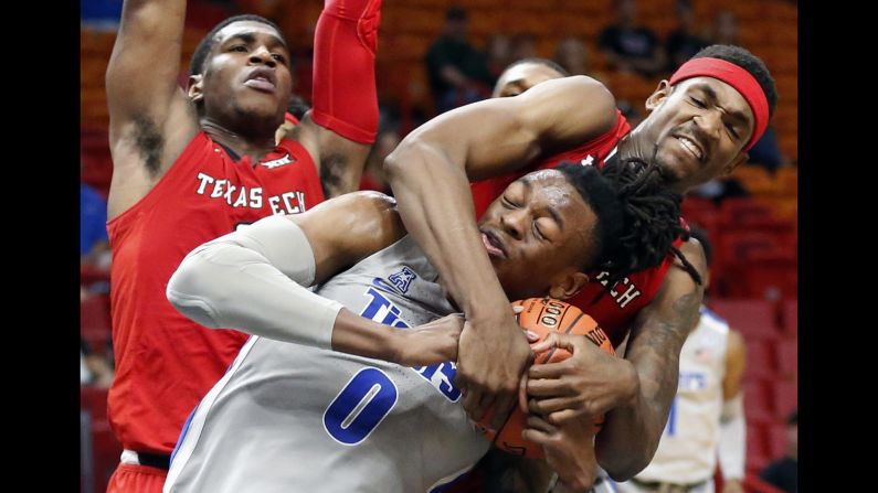 Texas Tech forward Tariq Owens, right, grabs Memphis forward Kyvon Davenport during the second half of an NCAA college basketball game at the Air Force Reserve Hoophall Miami Invitational on Saturday, December 1, in Miami.