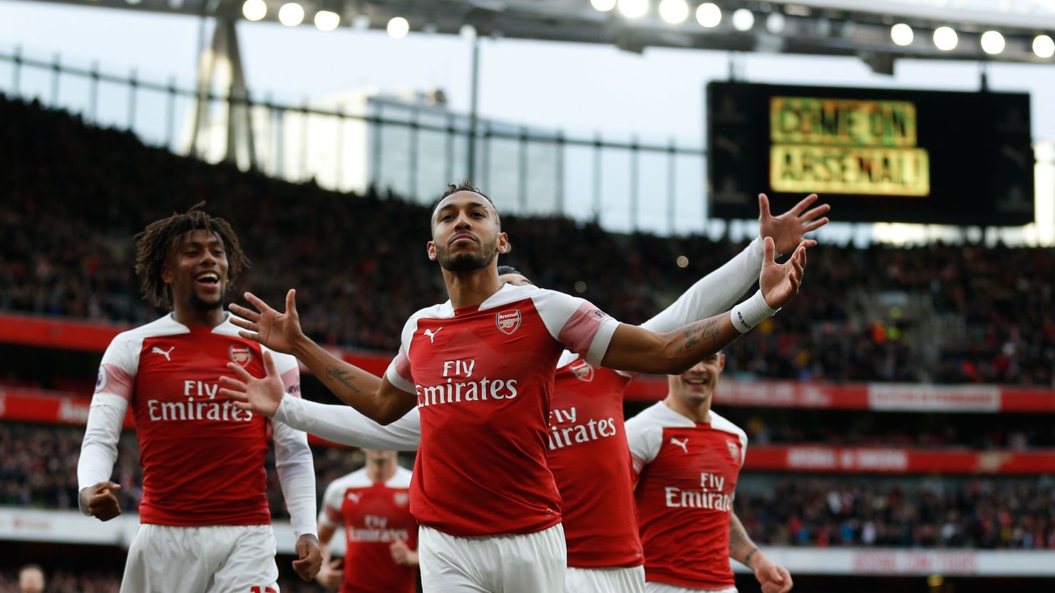 Arsenal's Pierre-Emerick Aubameyang celebrates after scoring the opening goal from the penalty spot during Arsenal's EPL encounter with Tottenham Hotspur at the Emirates Stadium.