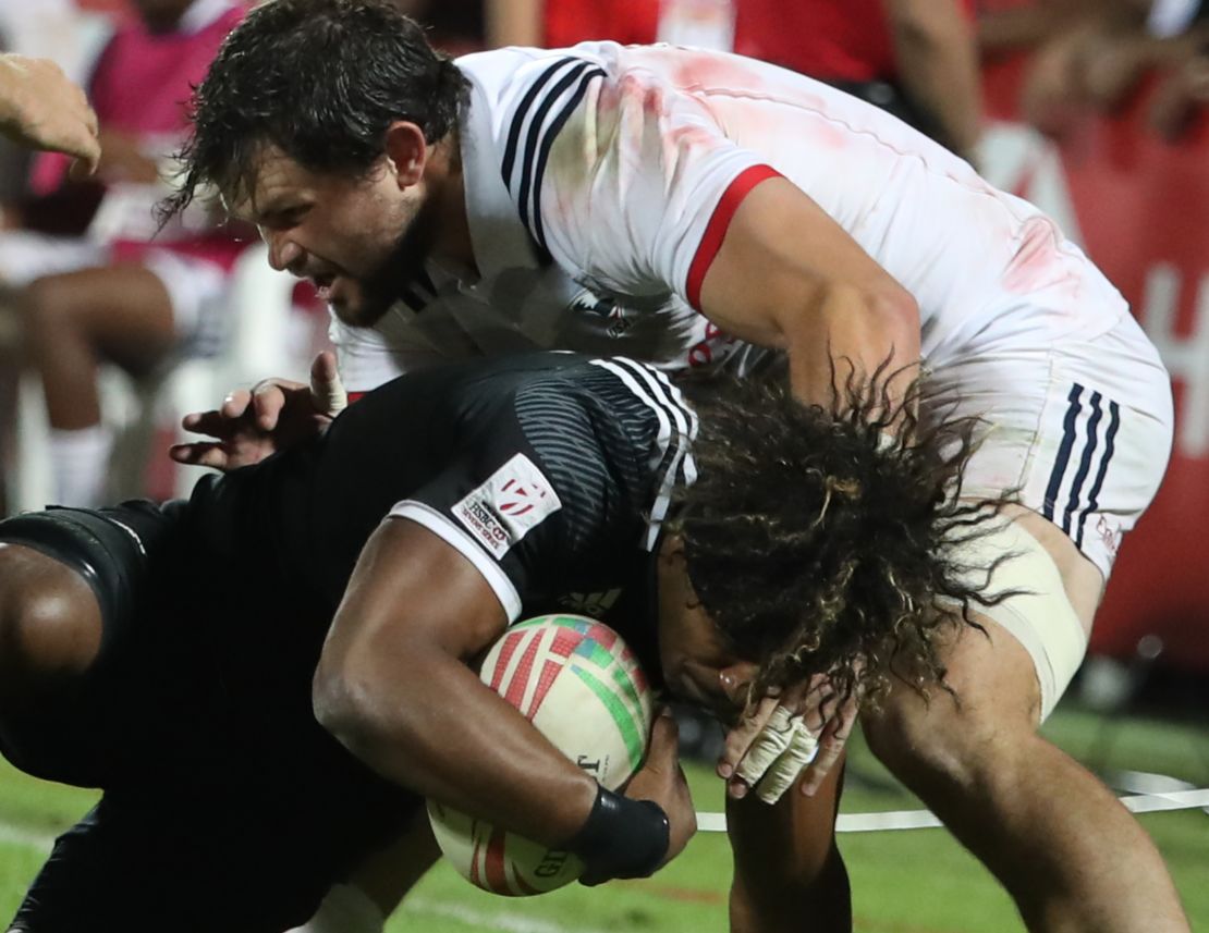 New Zealand's Luke Masirewa is tackled by USA's Ben Pinkelman.