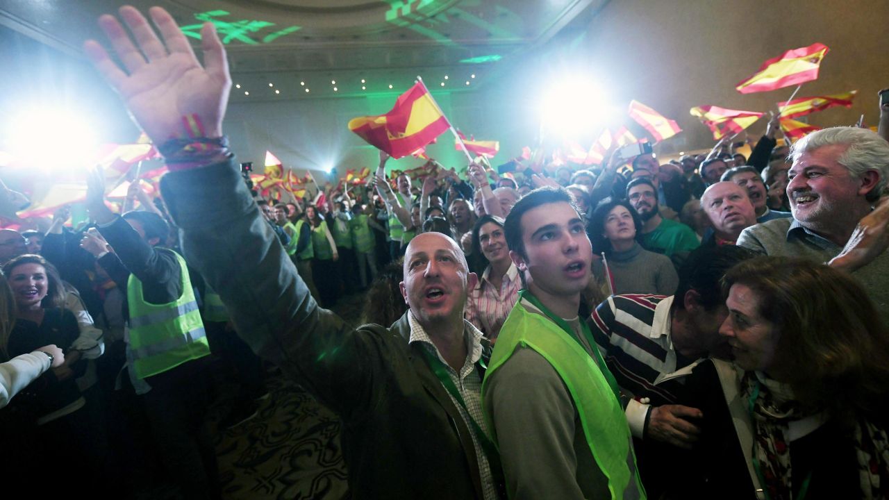Supporters of Spanish far-right party Vox celebrate during an election night party in Seville, Andalusia.