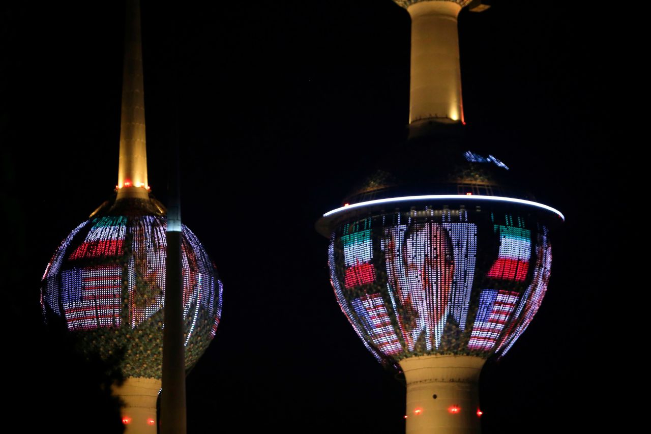 The Kuwait Towers in Kuwait City are illuminated with Bush's portrait and the colors of the American flag on December 1.
