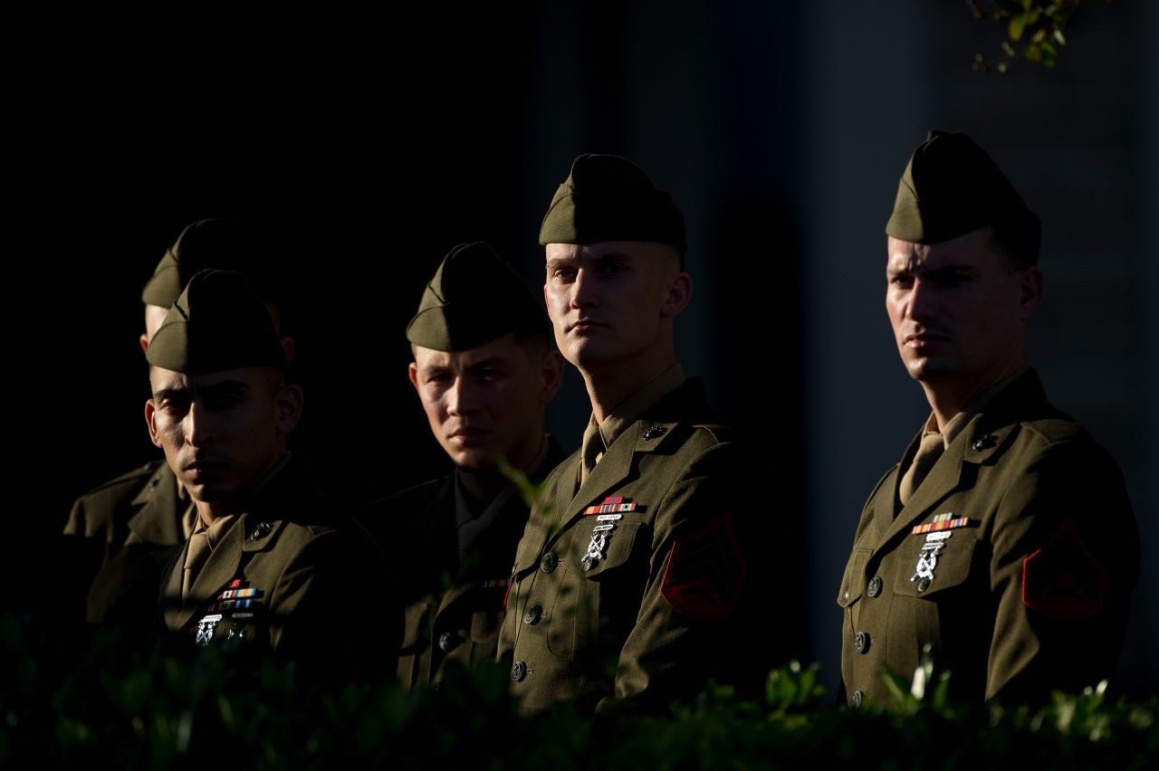 US Marines stand outside the Houston funeral home before Bush's casket was taken away.