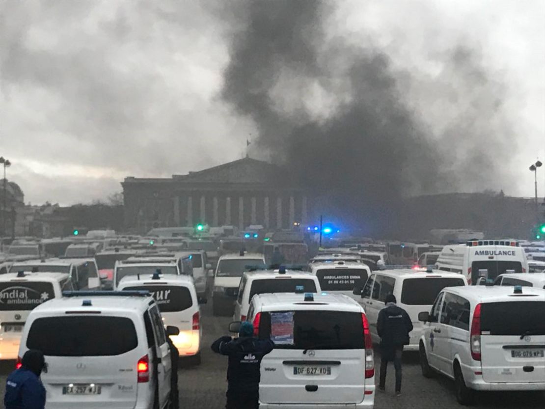 Paramedics join anti-government protests outside the National Assembly in Paris.