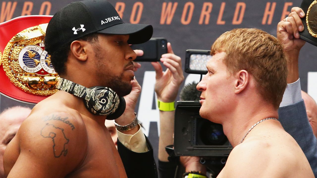 Anthony Joshua (left) has an outline of Africa on his right shoulder. 