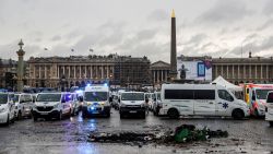 Dozens of ambulances block the Place de la Concorde square and bridge leading to the French National Assembly during a protest of ambulances owner and drivers on December 3, 2018, against their working conditions and for the withdrawal of the newly voted article 80 of the finance act on social security. (Photo by Thomas SAMSON / AFP)        (Photo credit should read THOMAS SAMSON/AFP/Getty Images)