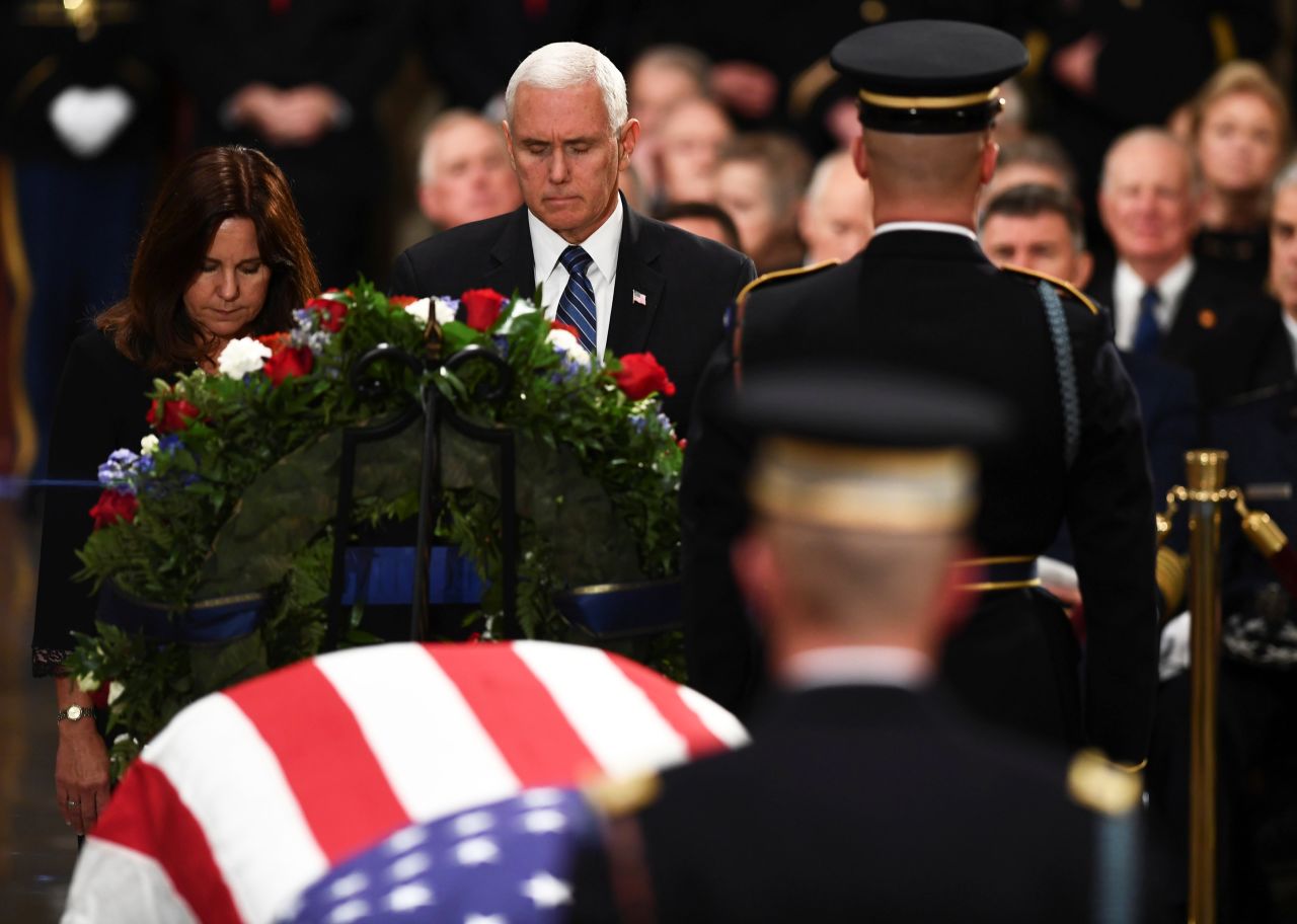 Vice President Mike Pence and his wife, Karen, pause near Bush's casket on December 3.