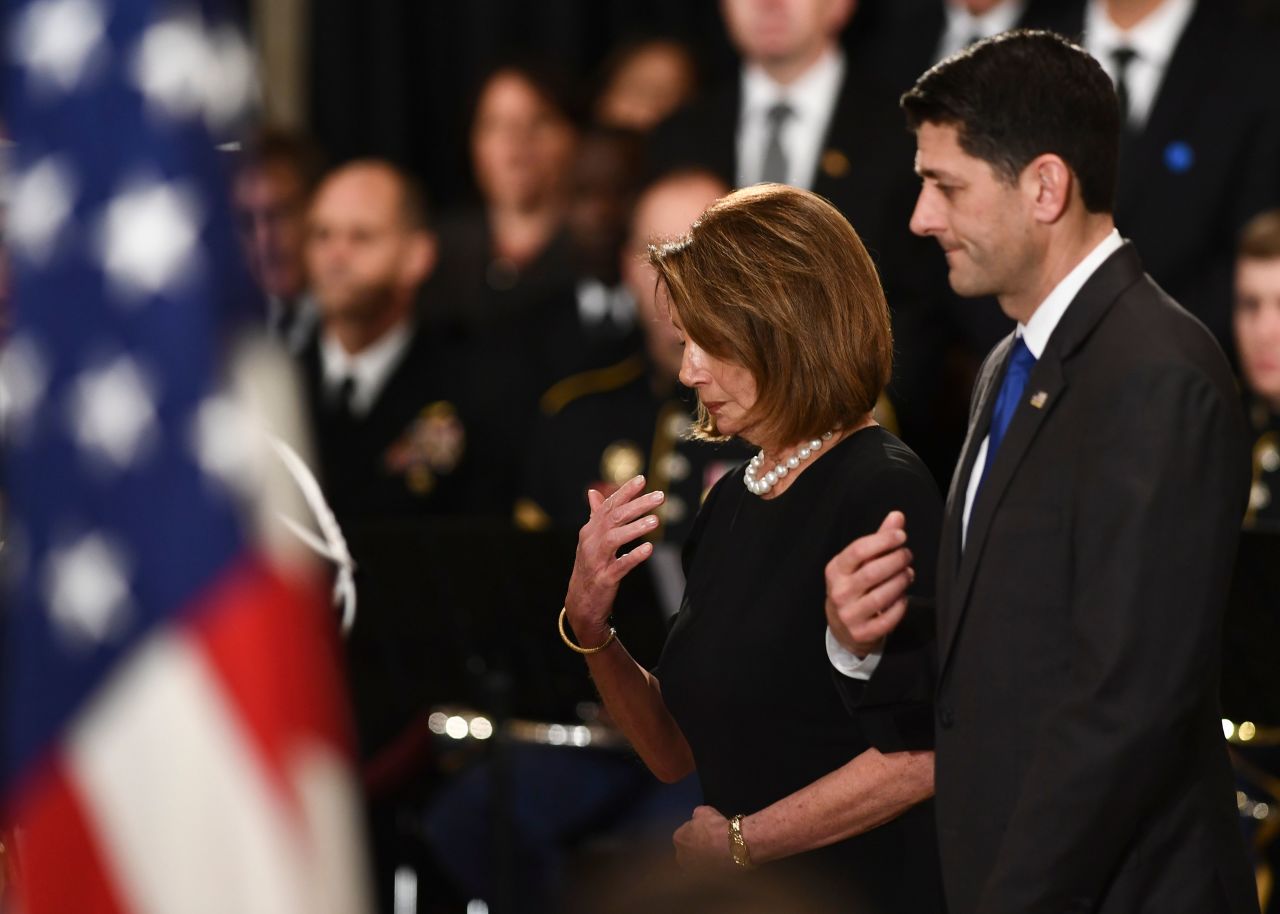 House Minority Leader Nancy Pelosi and House Speaker Paul Ryan pay their respects to Bush at the US Capitol.