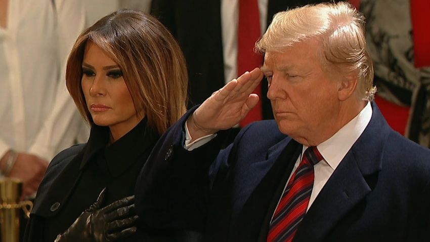 Donald Trump and Melania Trump pay respects to George H.W. Bush.