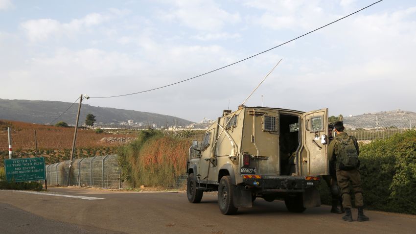 This picture taken on December 4, 2018 near the northern Israeli town of Metula, shows Israeli soldiers standing outside a military vehicle near the border with Lebanon. - Israel's army said on December 4 it had detected Hezbollah "attack tunnels" infiltrating its territory from Lebanon and had launched an operation called "Northern Shield" to destroy them, a move likely to raise tensions with the Iran-backed group. (Photo by JALAA MAREY / AFP)        (Photo credit should read JALAA MAREY/AFP/Getty Images)