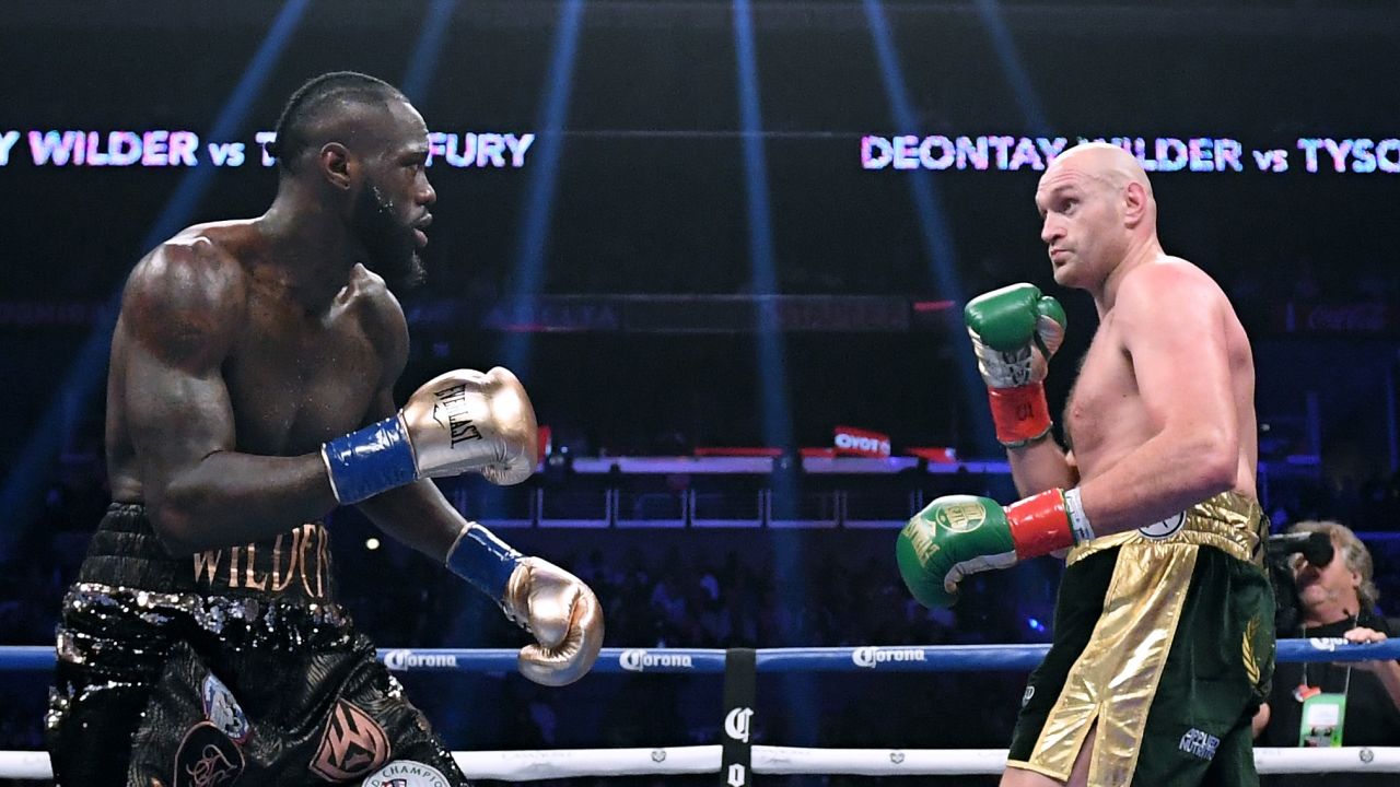 Joshua had been expected to fight either Deontay Wilder (left) or Tyson Fury (right) next.